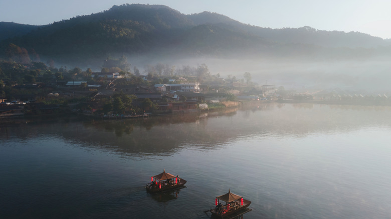 Ban Rak Thai with a light fog covering the hillside