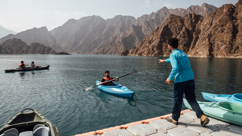 A kayaker paddles in a lake in Hatta, United Arab Emirates