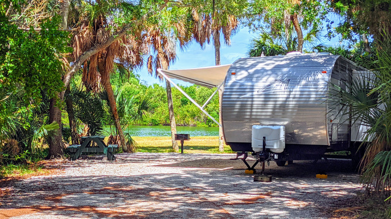 RV parked at waterside campsite