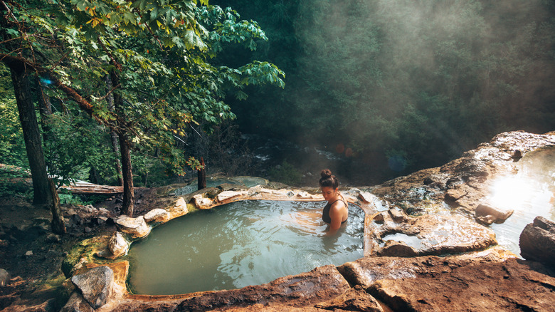 A woman soaks in a thermal pool in Umpqua National Forest