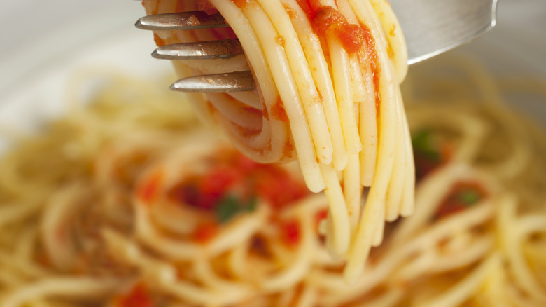 Twirling a bite-sized fork of pasta