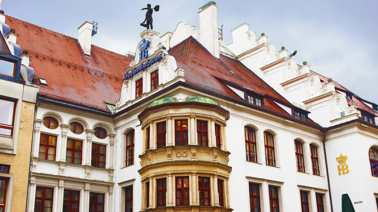 white building, red roof, chimneys