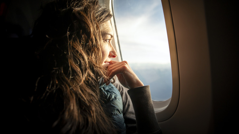 Airplane passenger looking out of the window