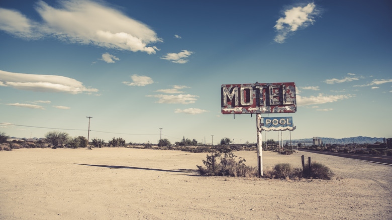 Abandoned motel sign in desert