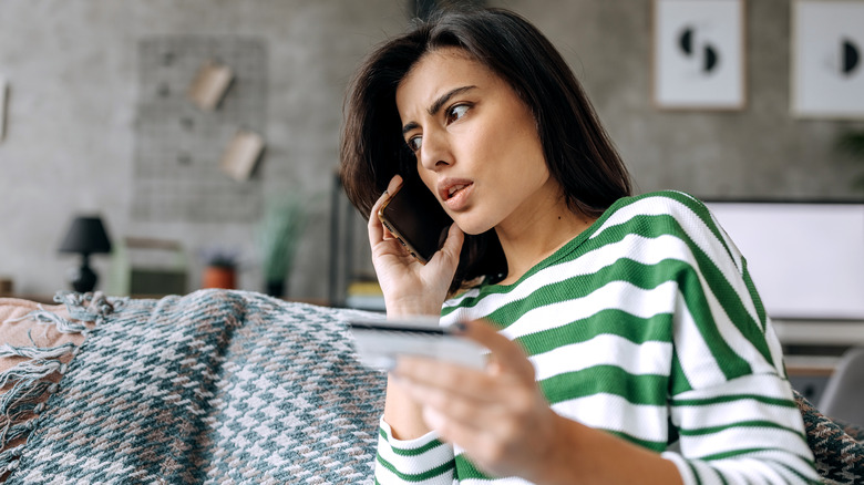 caller holding credit card