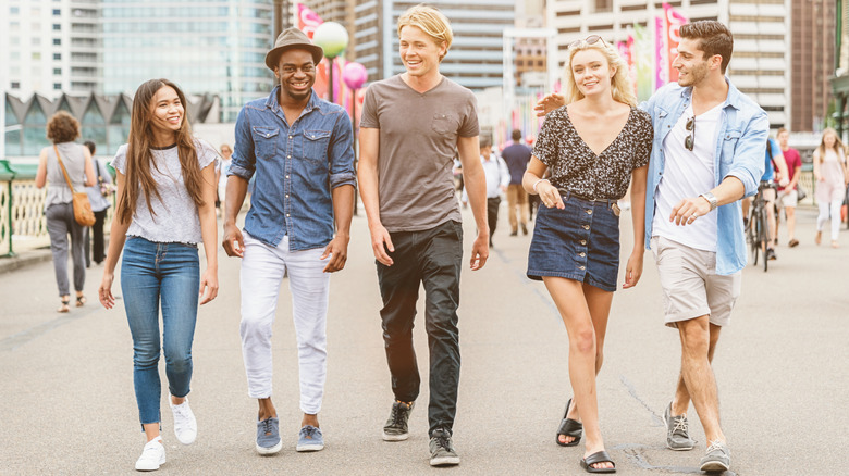 A group of friends walking at Darling Harbour