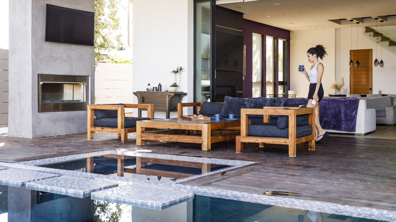 woman walking through luxurious house