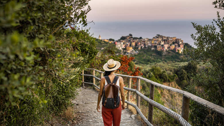 woman hiking towards Corniglia