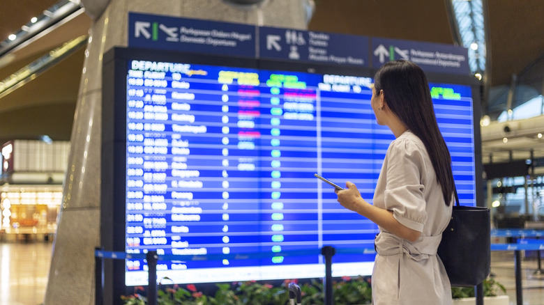 Person looking at departure board