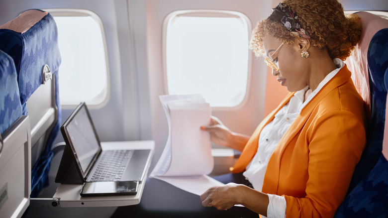 Woman in business class on an airplane