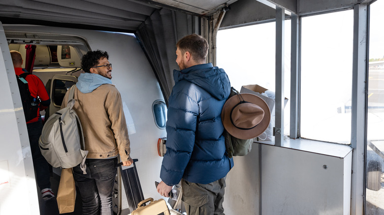 Passengers boarding plane