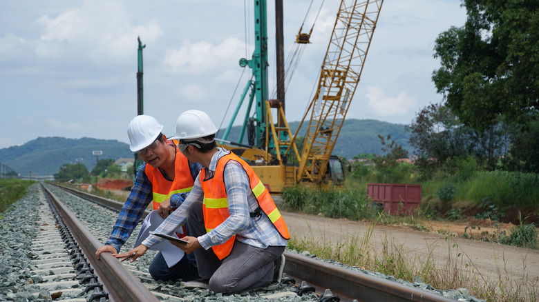 Engineers working on a railroad