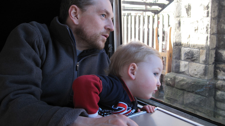 Father and son on train