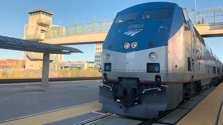 Amtrak train idles at station platform