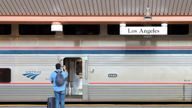 Person boarding Amtrak train