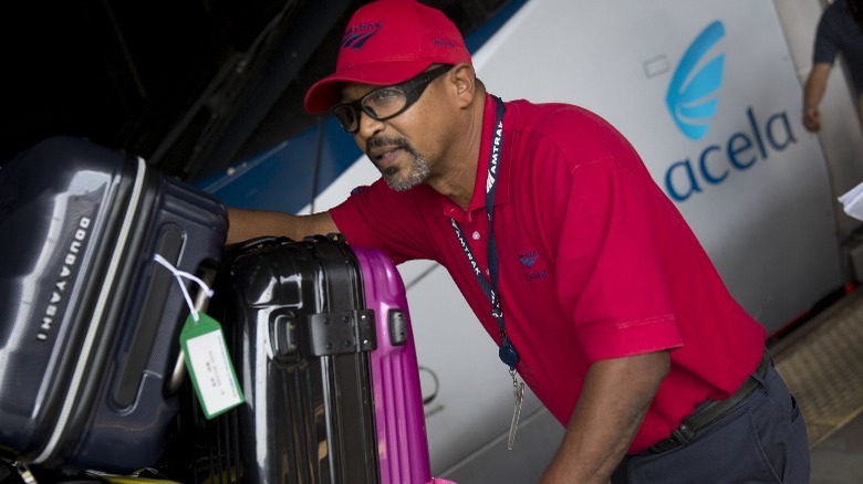 Amtrak Red Cap helping with bags