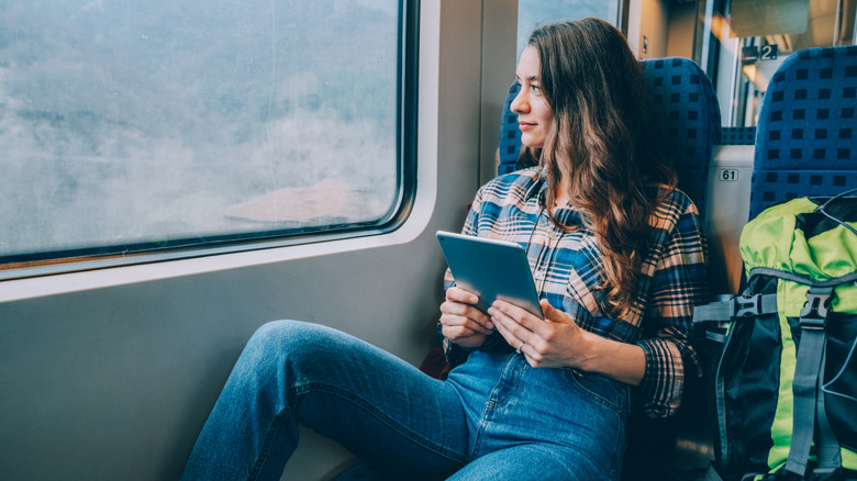 woman traveling on train