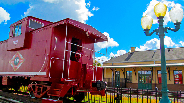 Red train car at the Mineola train station