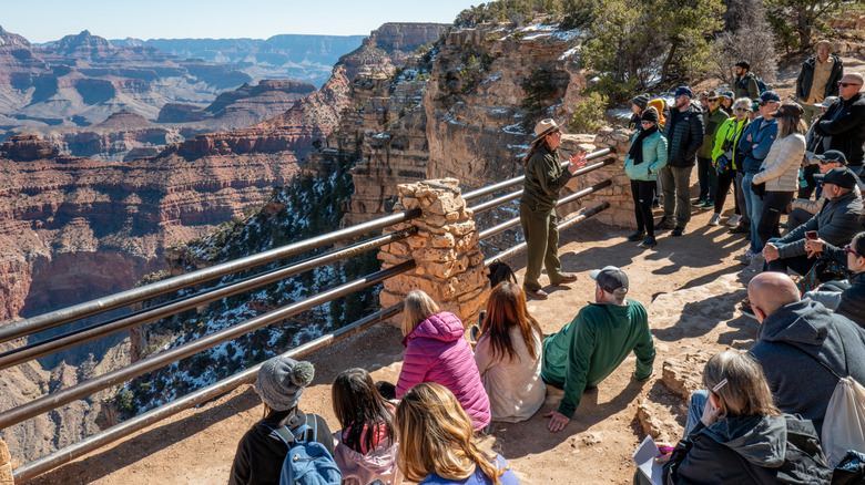 Park ranger speaking to group of visitors at Grand Canyon