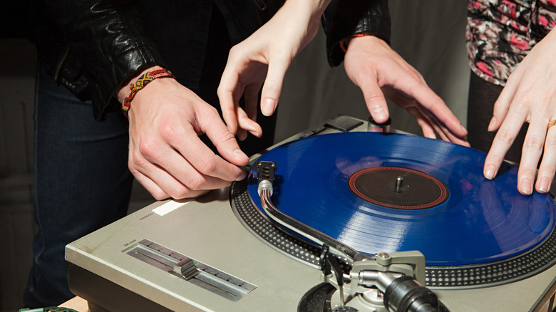 People playing vinyl records