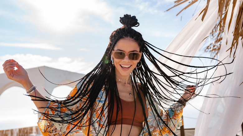 Happy girl with long braided beach hair