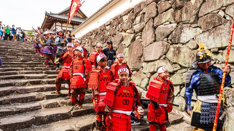 children in samurai costumes during a festival in Tatsuno