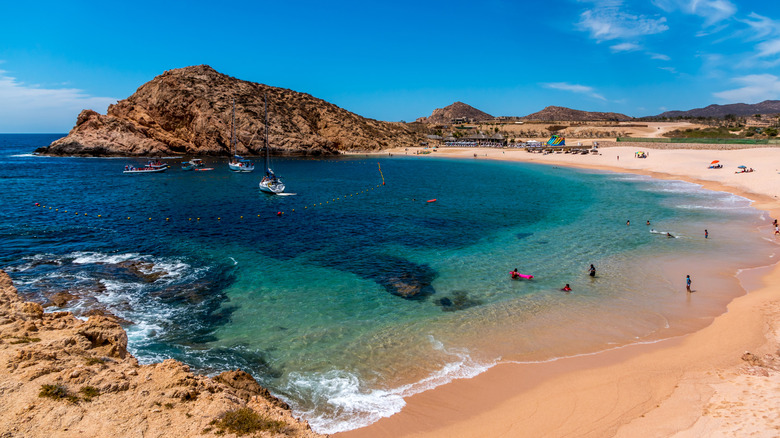 Blue ocean, beach, rocky cove