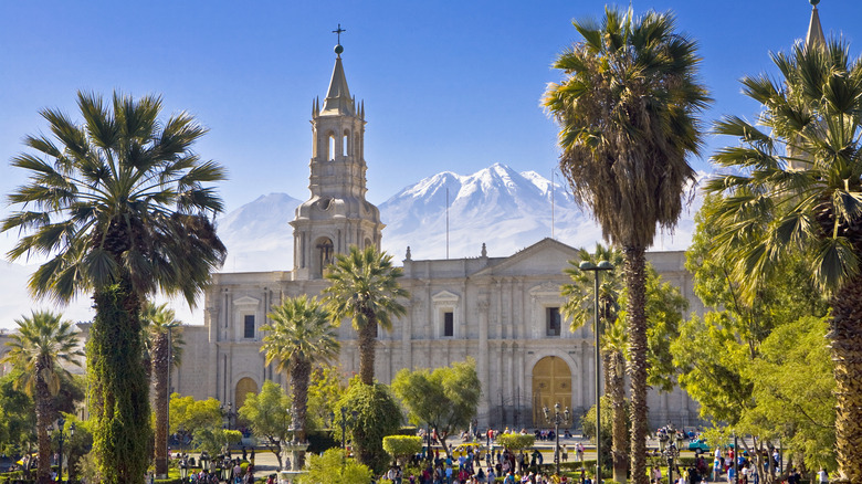 The Plaza De Armas exemplifies the architecture of Arequipa with the Andes mountains in the background.