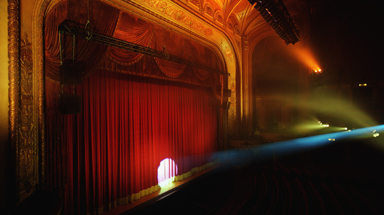 spotlight on red curtains on a stage