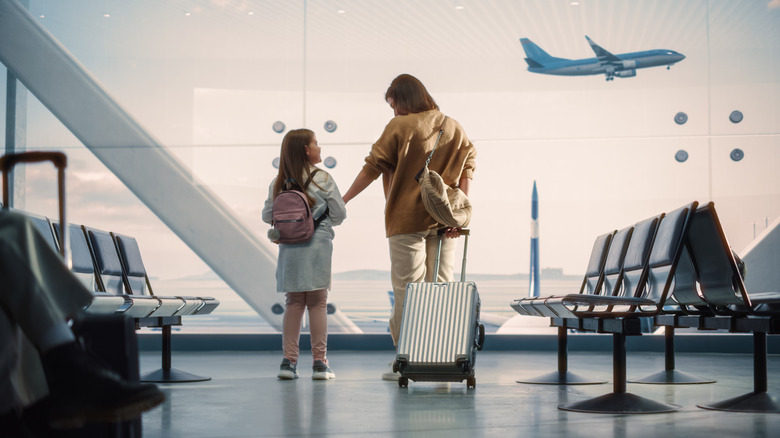 Mother with her daughter at the airport