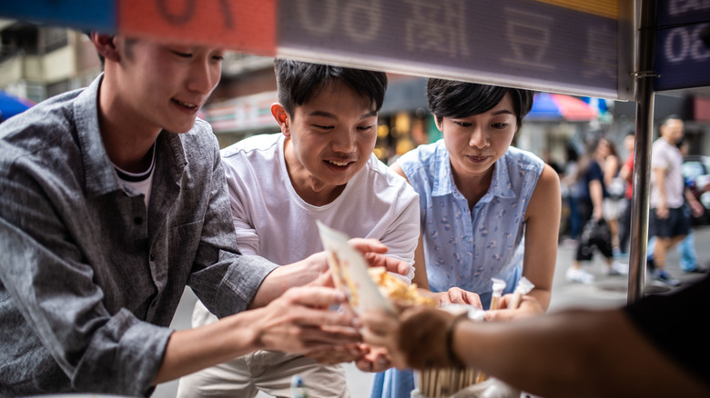 People ordering street food