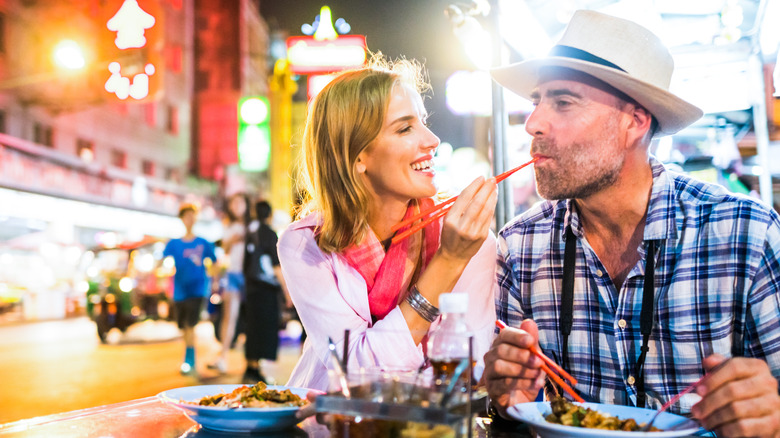 Couple eating street food