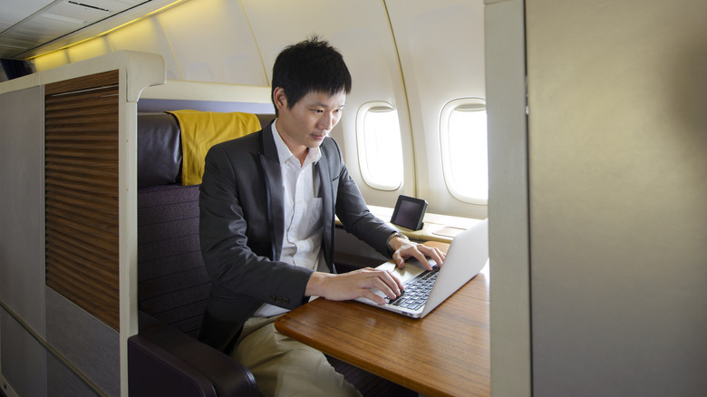 man in first class seat