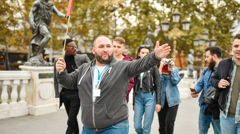 tour guide leading tourists