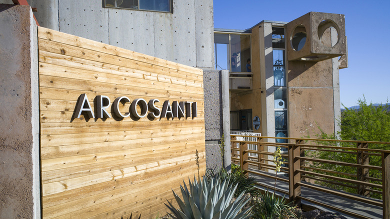 Arcosanti sign background building circular windows