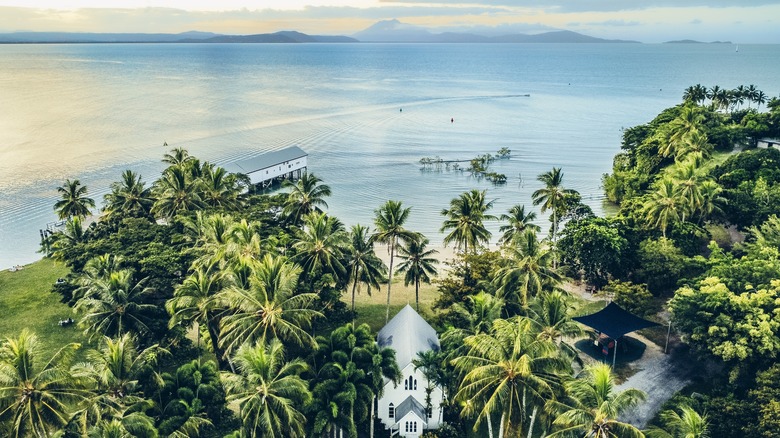 Port Douglas coastline with church and mountains in the distance