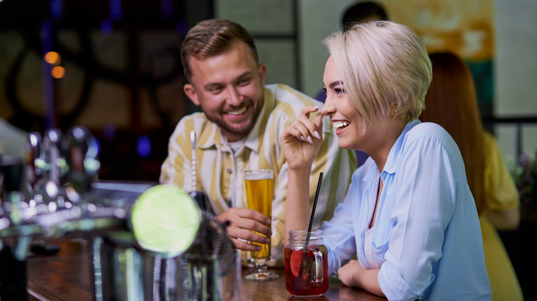 Man and woman laughing