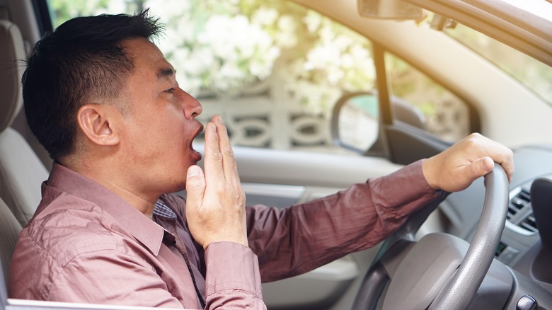 Yawning driver in car