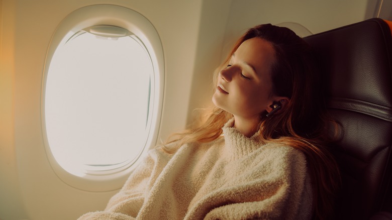 girl napping on plane