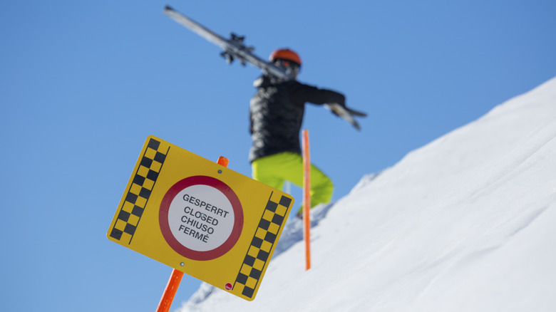 Closed sign on snowy mountain