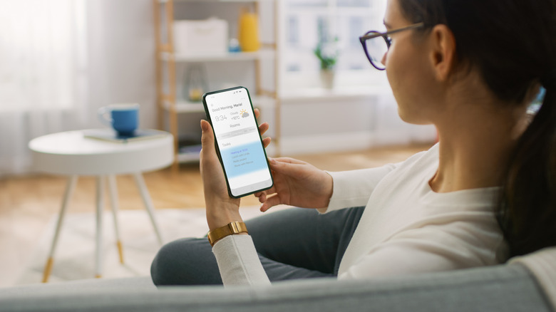 Woman checking weather app