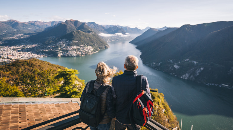 couple overlooking swiss mountains