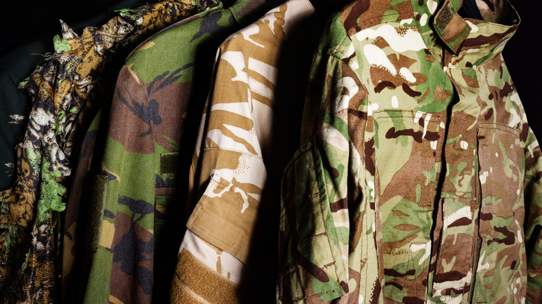 Hanging camouflage jackets in different patterns