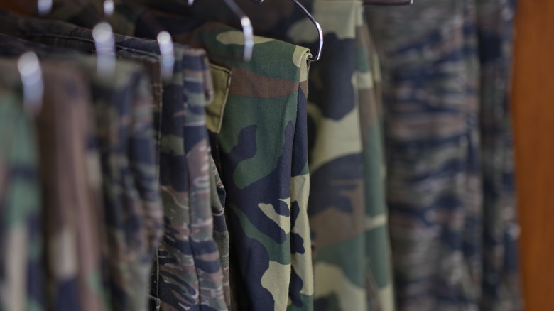 Camouflage clothing on a rack