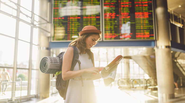 Traveling woman in train station