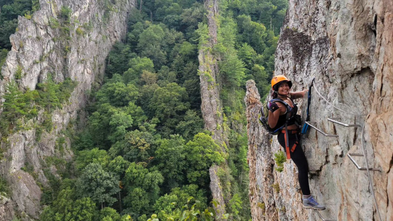 Rock climber clings to cliff at Nelson Rocks