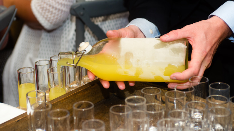 Limoncello poured into shot glass