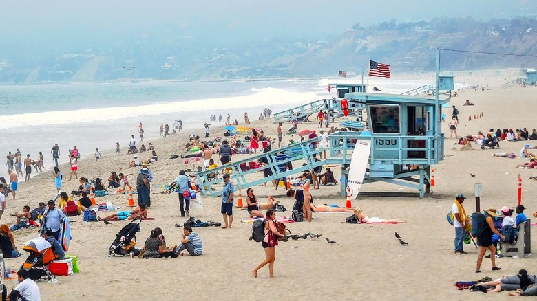 people, lifeguard stand on beach