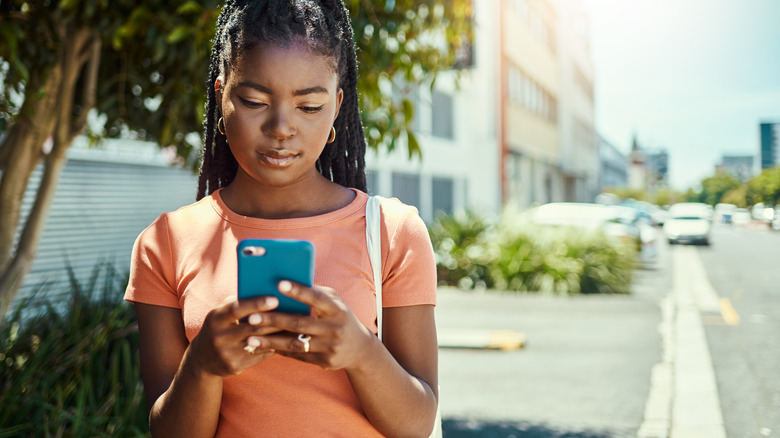 Woman texting on mobile phone