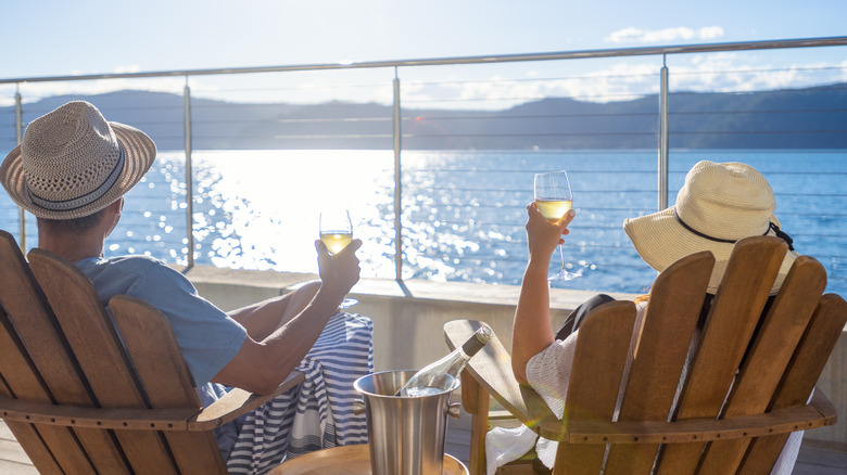 Couple having wine on cruise